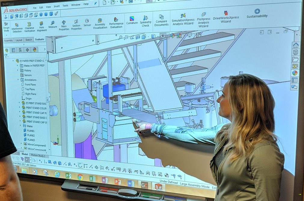 woman pointing at solidworks rendering